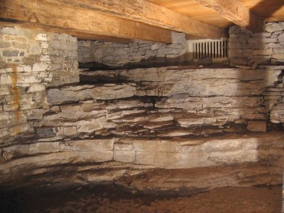 View of southeast corner of Fairfield House cellar, cut full height into the limestone of the site.